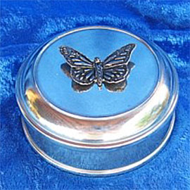Small pewter urn with decorative pewter butterfly on top